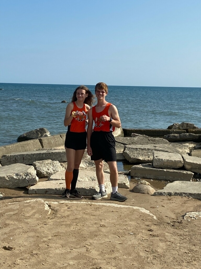Varsity Cross Country Runners Ashley Shindorf and Nick Tallman placed top 40 to earn medals at Harbor Beach